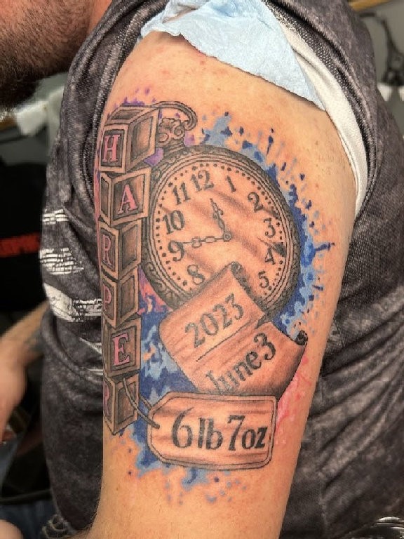 Color watercolor birth clock tattoo with alphabet blocks and date by Marks Art LLC in Rapid City.