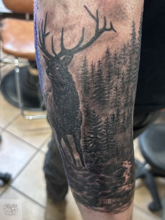 Realistic elk and forest tattoo by Marks Art LLC in Rapid City.