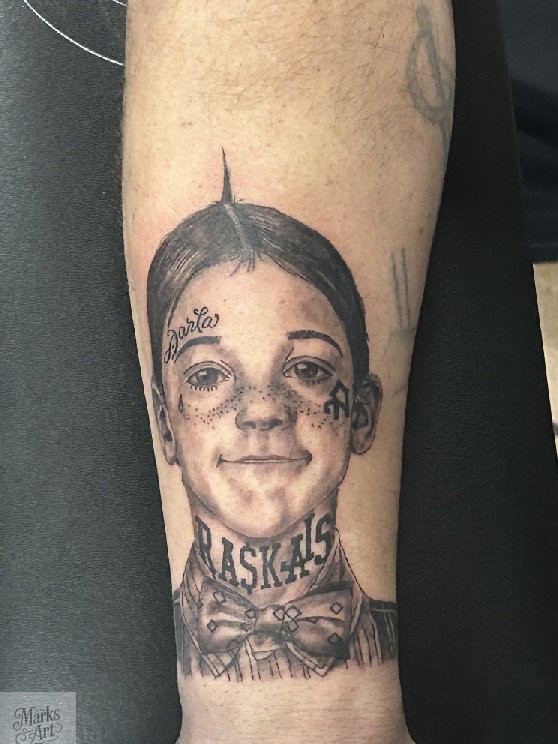 Realistic Alfalfa portrait tattoo with "Rascals" tattooed on his neck ''by Mark's Art LLC in Rapid City.