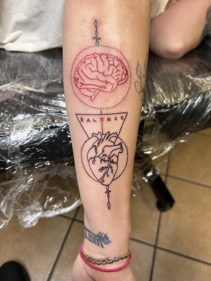 Custom black-and-grey anatomical heart and brain connected by geometric fine-line work.